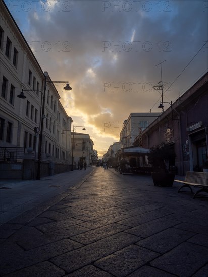 Dramatic clouds over a street, pedestrian zone, Olbia, Sardinia, Italy, Europe