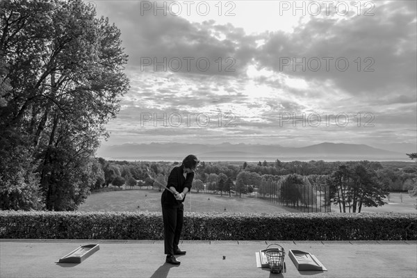 Woman on Driving Range with Panoramic View over Lake Geneva and Mountain in Switzerland. | MR:yes Maria-CH-02-05-2023