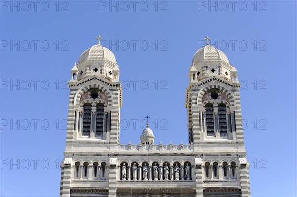 Marseille Cathedral or Cathedrale Sainte-Marie-Majeure de Marseille, 1852-1896, Marseille, Front view of the facade of a cathedral with double domes against a blue sky, Marseille, Departement Bouches-du-Rhone, Region Provence-Alpes-Cote d'Azur, France, Europe