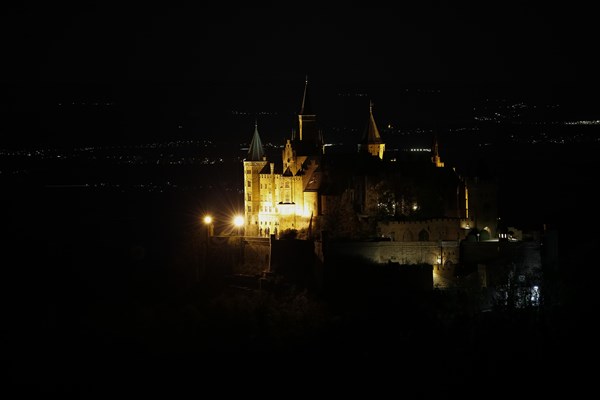 Hohenzollern Castle, ancestral castle of the princely family and former ruling Prussian royal and German imperial house of Hohenzollern, summit castle, historical building by the Berlin architect Friedrich August Stueler, architecture, neo-Gothic, castle building, aristocratic residence, south view from the Zellerhorn, night view, illumination, artificial light, Bisingen, Zollernalbkreis, Baden-Wuerttemberg, Germany, Europe