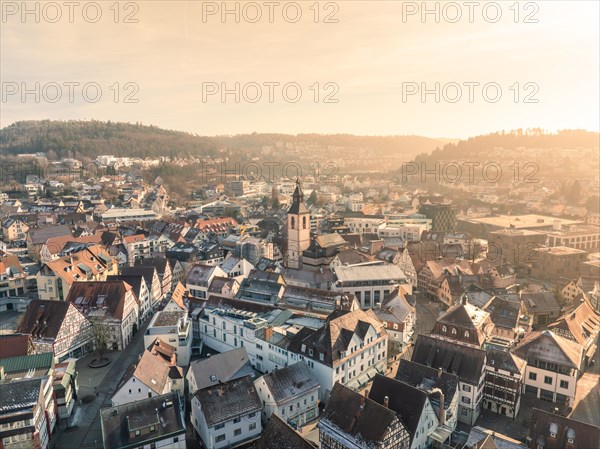 Sunset over a town with church towers and densely built-up houses, sunrise, Nagold, Black Forest, Germany, Europe