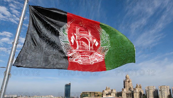 Flag, the national flag of Afghanistan flutters in the wind