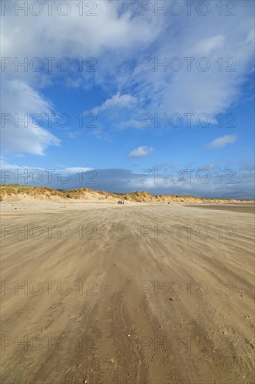 Sand blowing over beach, clouds, LLanddwyn Bay, Newborough, Isle of Anglesey, Wales, Great Britain