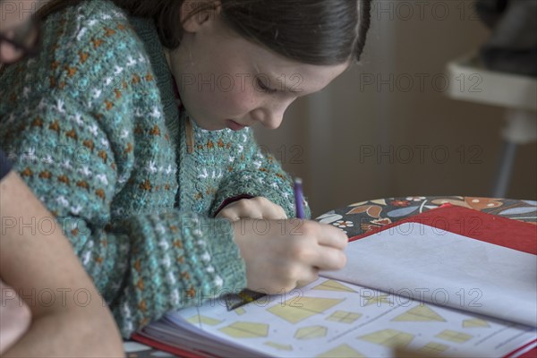 Girl, 10 years old, doing schoolwork, Mecklenburg-Western Pomerania, Germany, Europe