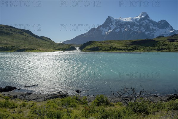 Waterfall, Lago Pehoe, mountain range of the Andes, Torres del Paine National Park, Parque Nacional Torres del Paine, Cordillera del Paine, Towers of the Blue Sky, Region de Magallanes y de la Antartica Chilena, Ultima Esperanza province, UNESCO biosphere reserve, Patagonia, end of the world, Chile, South America