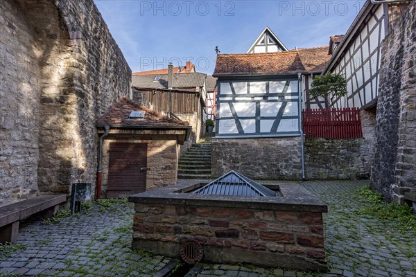 Historic town fountain at the Schelmenpforte on the town wall, 11th century, cultural monument, listed building, old town, Ortenberg, Vogelsberg, Wetterau, Hesse, Germany, Europe