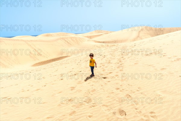 Little boy enjoying in the dunes of Maspalomas, Gran Canaria, Canary Islands