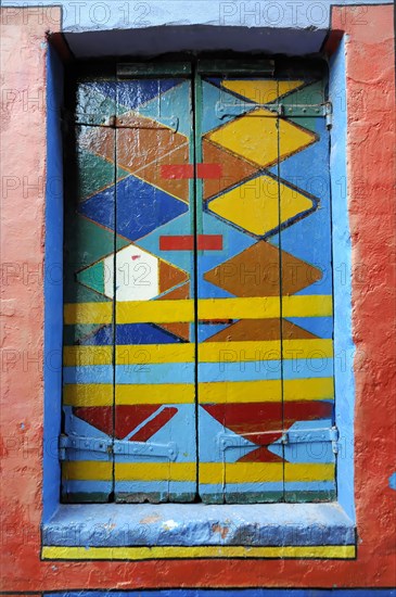 Colourful houses, Burano, Burano Island, Abstract artwork on a window with bright colours and geometric shapes, Burano, Venice, Veneto, Italy, Europe