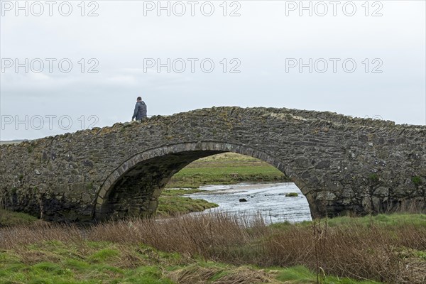 Stone bridge, man, Aberffraw, Isle of Anglesey, Wales, Great Britain