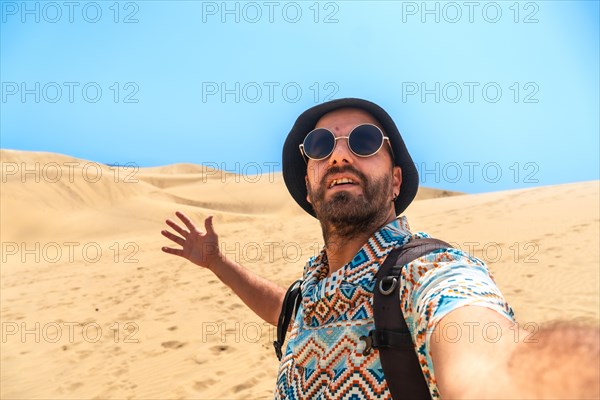 Selfie of a tourist enjoying in the dunes of Maspalomas, Gran Canaria, Canary Islands