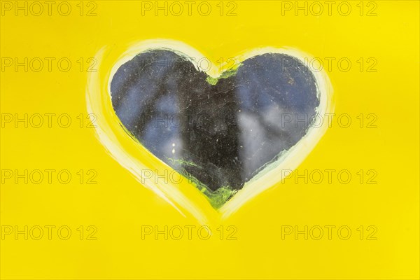 Heart as the window of a yellow toilet block, Bremen, Germany, Europe