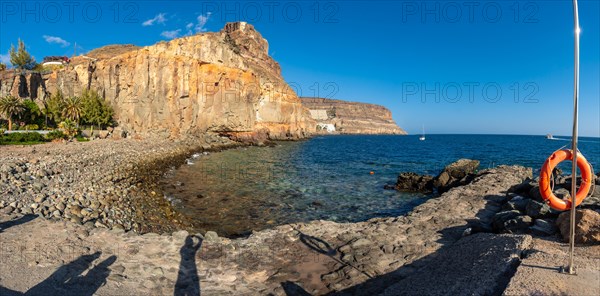 Panoramic of the cove or Caleta of the touristic coastal town Mogan in the south of Gran Canaria in summer. Spain