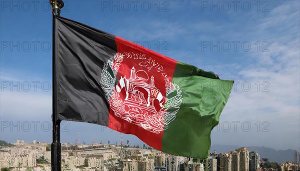 Flag, the national flag of Afghanistan flutters in the wind