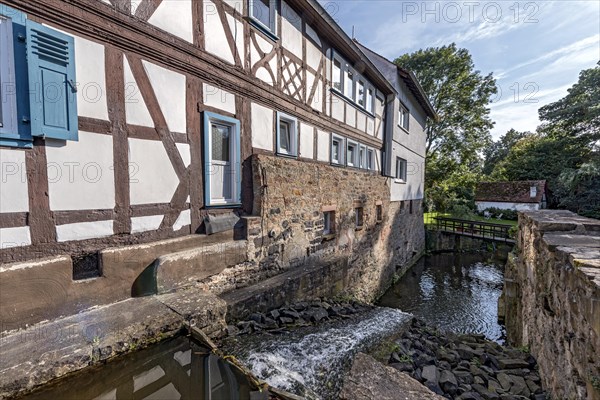 Former mill on the Muehlgraben, historic half-timbered house from around 1709, cultural monument, listed building, old town, Ortenberg, Vogelsberg, Wetterau, Hesse, Germany, Europe