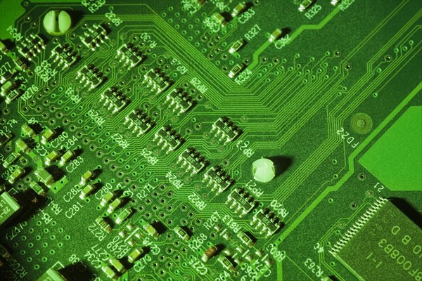 Close-up of green lighted electronic computer circuit board with lines, Studio Composition, Quebec, Canada, North America