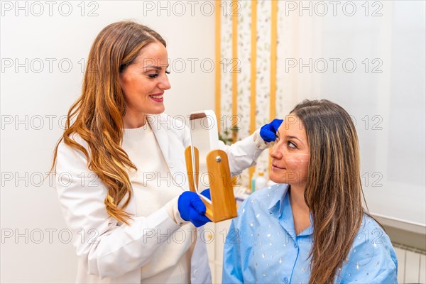 Doctor and client before a plastic surgery using hyaluronic acid
