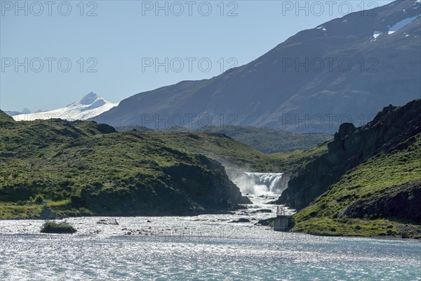 Lago Pehoe, waterfall, Mirador Salto Grande, sidelight, Torres del Paine National Park, Parque Nacional Torres del Paine, Cordillera del Paine, Towers of the Blue Sky, Region de Magallanes y de la Antartica Chilena, Ultima Esperanza Province, UNESCO Biosphere Reserve, Patagonia, End of the World, Chile, South America