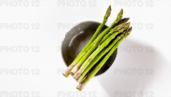 Stylish image of asparagus sticking out of a bowl against a white background, AI generated, AI generated