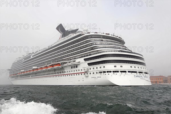 Cruise ship CARNEVAL DREAM, 306m, year of construction 2009, 4631 passengers, entering the harbour of Venice, A white cruise ship against a clear sky, Venice, Veneto, Italy, Europe