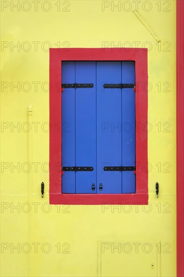 Colourful houses, Burano, Burano Island, Bright yellow wall with blue shutters and a red frame, Burano, Venice, Veneto, Italy, Europe