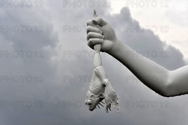 Charles Ray's statue of the boy with a frog on the top of the Zattere A surreal sculpture of a hand holding a key with a frog hanging out of it, Venice, Veneto, Italy, Europe