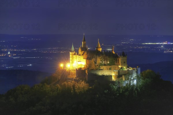 Hohenzollern Castle, ancestral castle of the princely family and former ruling Prussian royal and German imperial house of Hohenzollern, summit castle, historical building by the Berlin architect Friedrich August Stueler, architecture, neo-Gothic, castle building, aristocratic residence, south view from the Zellerhorn, night view, illumination, artificial light, Bisingen, Zollernalbkreis, Baden-Wuerttemberg, Germany, Europe