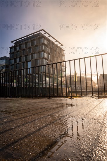 Ibis Styles Hotel, Modern architecture with reflection in a puddle, captured in daylight, sunrise, Nagold, Black Forest, Germany, Europe