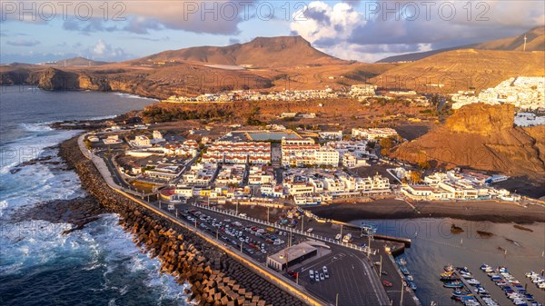Aerial view of the town of Agaete and its Puerto de las Nieves at summer sunset in Gran Canaria. Spain