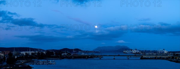 Full moon over the harbour of Olbia, blue hour, panoramic shot, Olbia, Sardinia, Italy, Europe