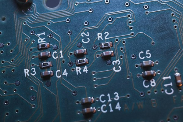 Close-up of blue lighted electronic computer circuit board with microchips and lines, Studio Composition, Quebec, Canada, North America