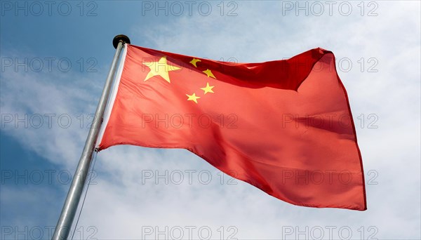 Flag, the national flag of China flutters in the wind