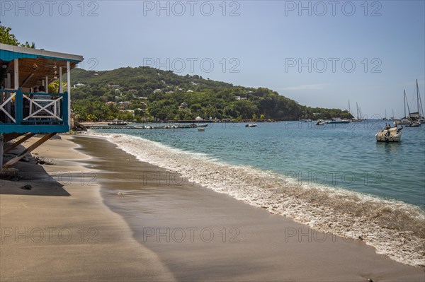 A beach in the Caribbean on the Atlantic coast in Deshaies, Guadeloupe, French Antilles, North America