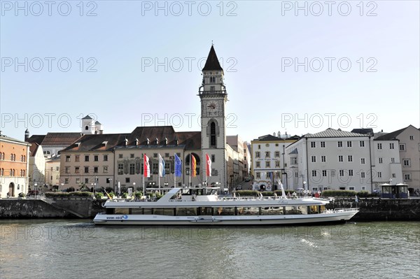 Ships on the river (Danube) in front of a town with a prominent church tower, Passau, Bavaria, Germany, Europe