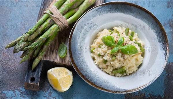 A plate of risotto with green asparagus on a dark blue background, Risotto with green asparagus, KI generated, AI generated