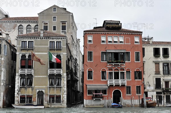 Colourful buildings on a canal, Canal Grande, in Venice with cloudy sky, Venice, Veneto, Italy, Europe