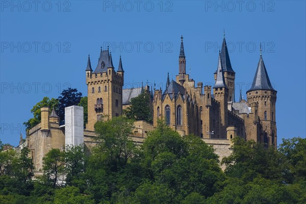 Hohenzollern Castle, ancestral castle of the princely family and former ruling Prussian royal and German imperial house of Hohenzollern, summit castle, historical building by the Berlin architect Friedrich August Stueler, architecture, neo-Gothic, castle building, aristocratic residence, east view, blue sky, Bisingen, Zollernalbkreis, Baden-Wuerttemberg, Germany, Europe