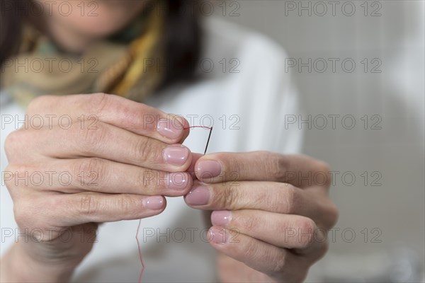 Woman Sewing with Needle in Italy. | MR:yes Maria CH 01-04-2018