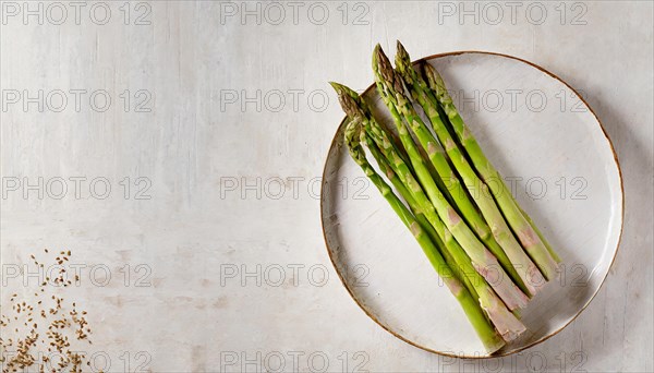 A simple plate with green asparagus on a rustic linen background, KI generated, AI generated