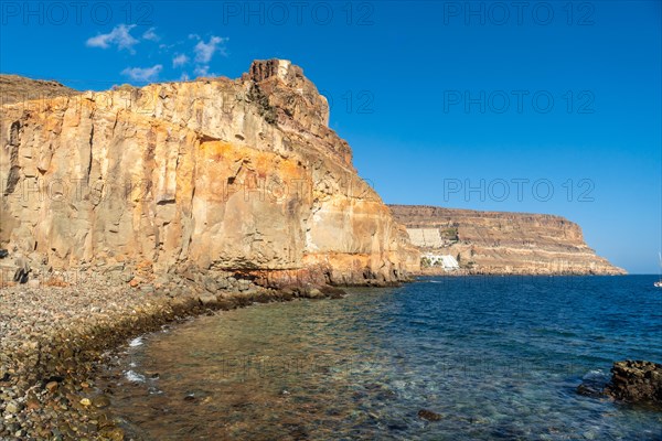 The cove or Caleta of the touristic coastal town Mogan in the south of Gran Canaria in summer. Spain