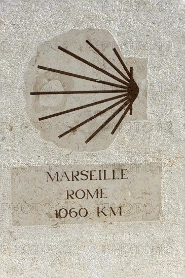 Stone wall with a signpost indicating the distance between Marseille and Rome, Marseille, Departement Bouches-du-Rhone, Provence-Alpes-Cote d'Azur region, France, Europe