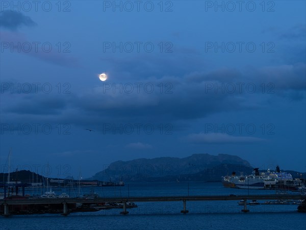 Full moon over the harbour of Olbia, Olbia, Sardinia, Italy, Europe