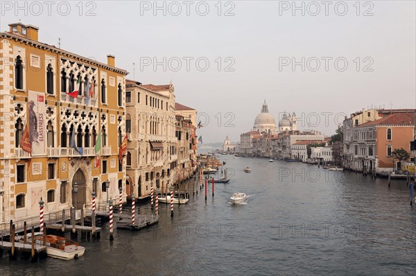 Grand Canal, behind the church of Santa Maria della Saluti, Early morning at the Grand Canal in Venice with sunlit buildings and boats, Venice, Veneto, Italy, Europe