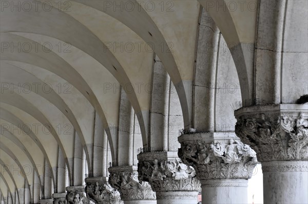 St Mark's Square, stone arcades with rhythmic arches and shadow play, Venice, Veneto, Italy, Europe