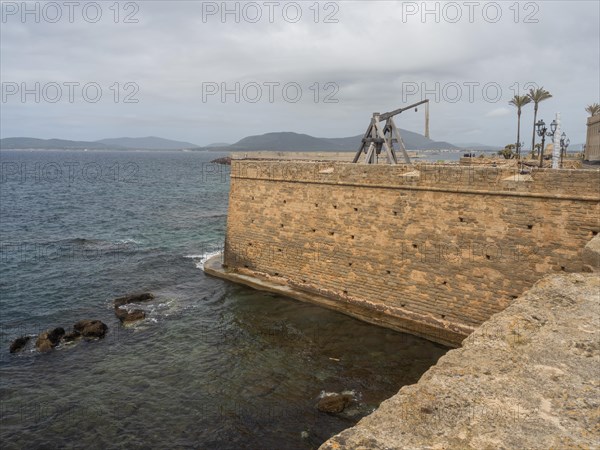 Old siege engine, fortress wall of Alghero, Sardinia, Italy, Europe