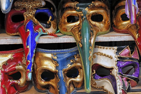 Island of Murano, Venice, Extravagantly decorated Venetian carnival masks in vivid colours, Venice, Veneto, Italy, Europe