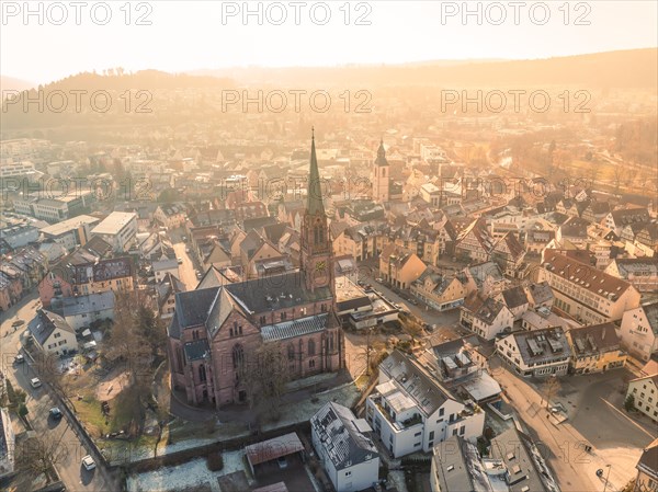 Large church dominates the city skyline in the warm sunset light, sunrise, Nagold, Black Forest, Germany, Europe