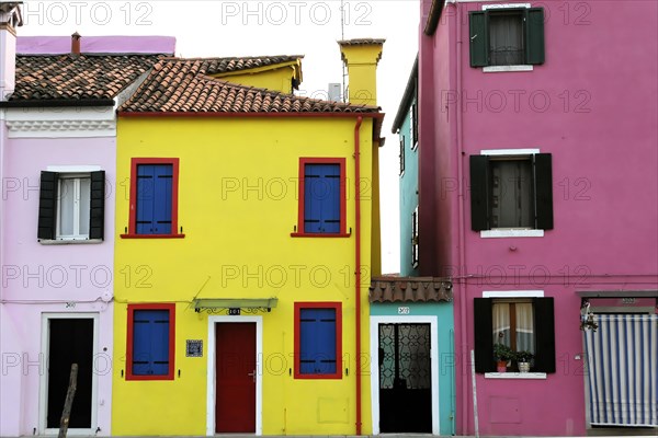 Colourful houses, Burano, Burano Island, Two brightly coloured houses next to each other, one yellow and the other pink, Burano, Venice, Veneto, Italy, Europe