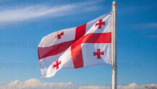 Flags, the national flag of Georgia flutters in the wind