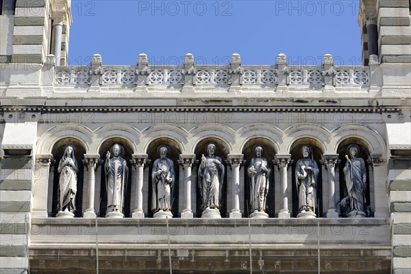 Marseille Cathedral or Cathedrale Sainte-Marie-Majeure de Marseille, 1852-1896, Marseille, row of stone figures on the exterior facade of a church, Marseille, Departement Bouches-du-Rhone, Region Provence-Alpes-Cote d'Azur, France, Europe