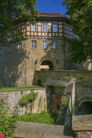 Access to the moated castle Sachsenheim, Grosssachsenheim Castle, former moated castle, archway, wall, bridge, passage, coat of arms, with inscription, exterior lights, lamps, architecture, historic building from the 15th century, Sachsenheim, Ludwigsburg district, Baden-Wuerttemberg, Germany, Europe